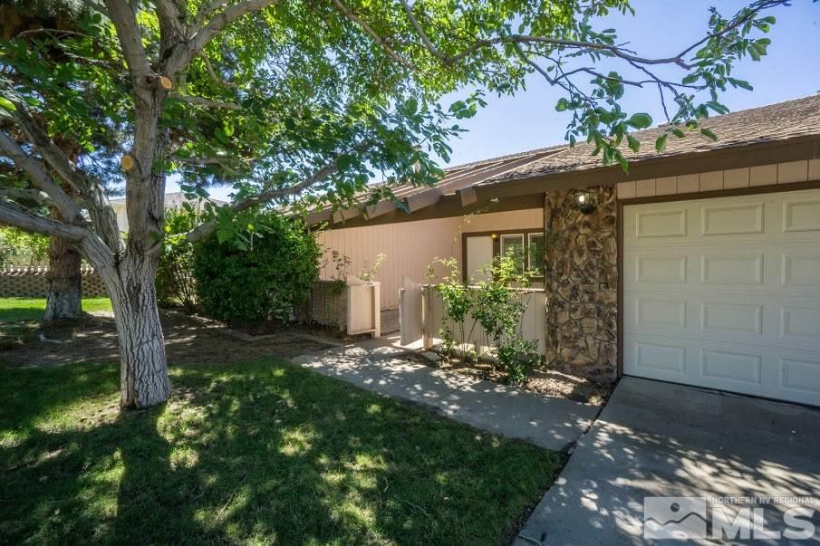 14045 Chamy Drive Reno, NV 89521 - Photo 25 of 25 a view of a house with a tree in the yard next to a yard