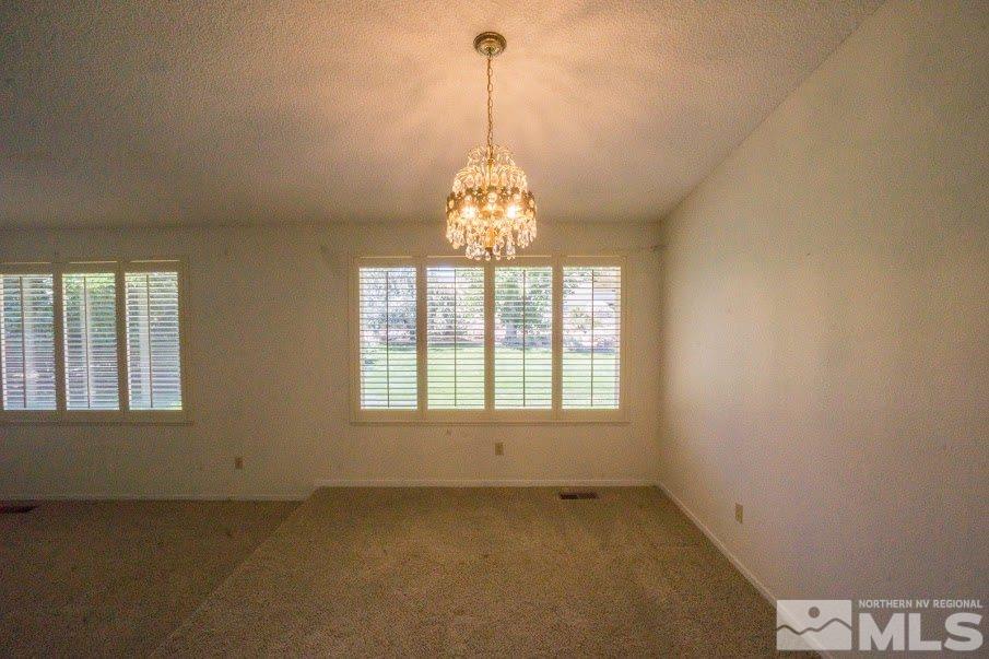 14045 Chamy Drive Reno, NV 89521 - Photo 4 of 25 a view of an empty room with a window