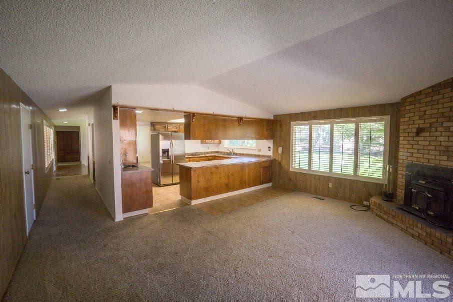 14045 Chamy Drive Reno, NV 89521 - Photo 9 of 25 a view of livingroom with furniture and a fireplace