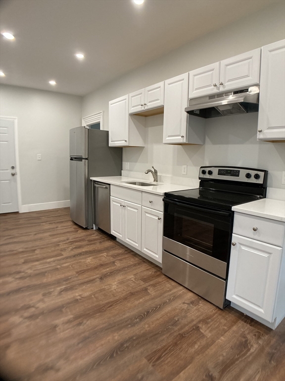 78 West Central Street, Unit 2 Natick, MA 01760 - Photo 3 of 12 a kitchen with stainless steel appliances granite countertop a stove and a sink