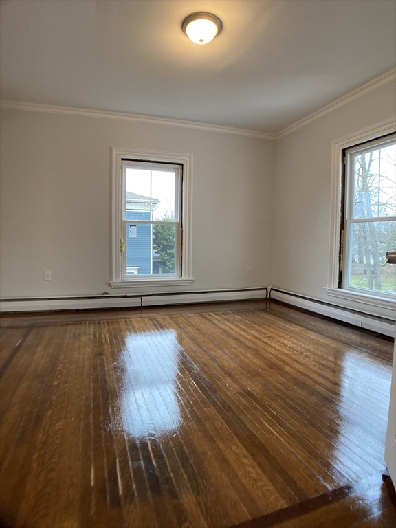 78 West Central Street, Unit 2 Natick, MA 01760 - Photo 8 of 12 a view of a room with wooden floor and window