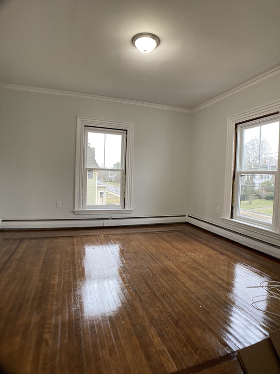 78 West Central Street, Unit 2 Natick, MA 01760 - Photo 10 of 12 wooden floor in an empty room with a window