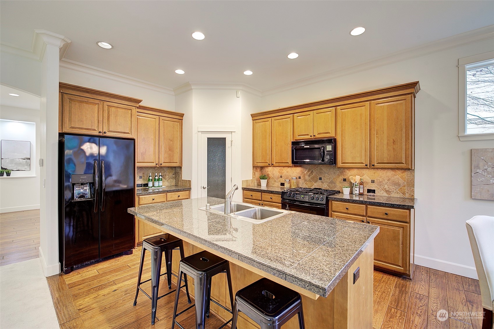 729 South 37th Street Renton, WA 98055 - Photo 8 of 36 a kitchen with stainless steel appliances granite countertop sink refrigerator and microwave