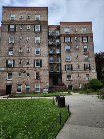 a view of a building with a yard