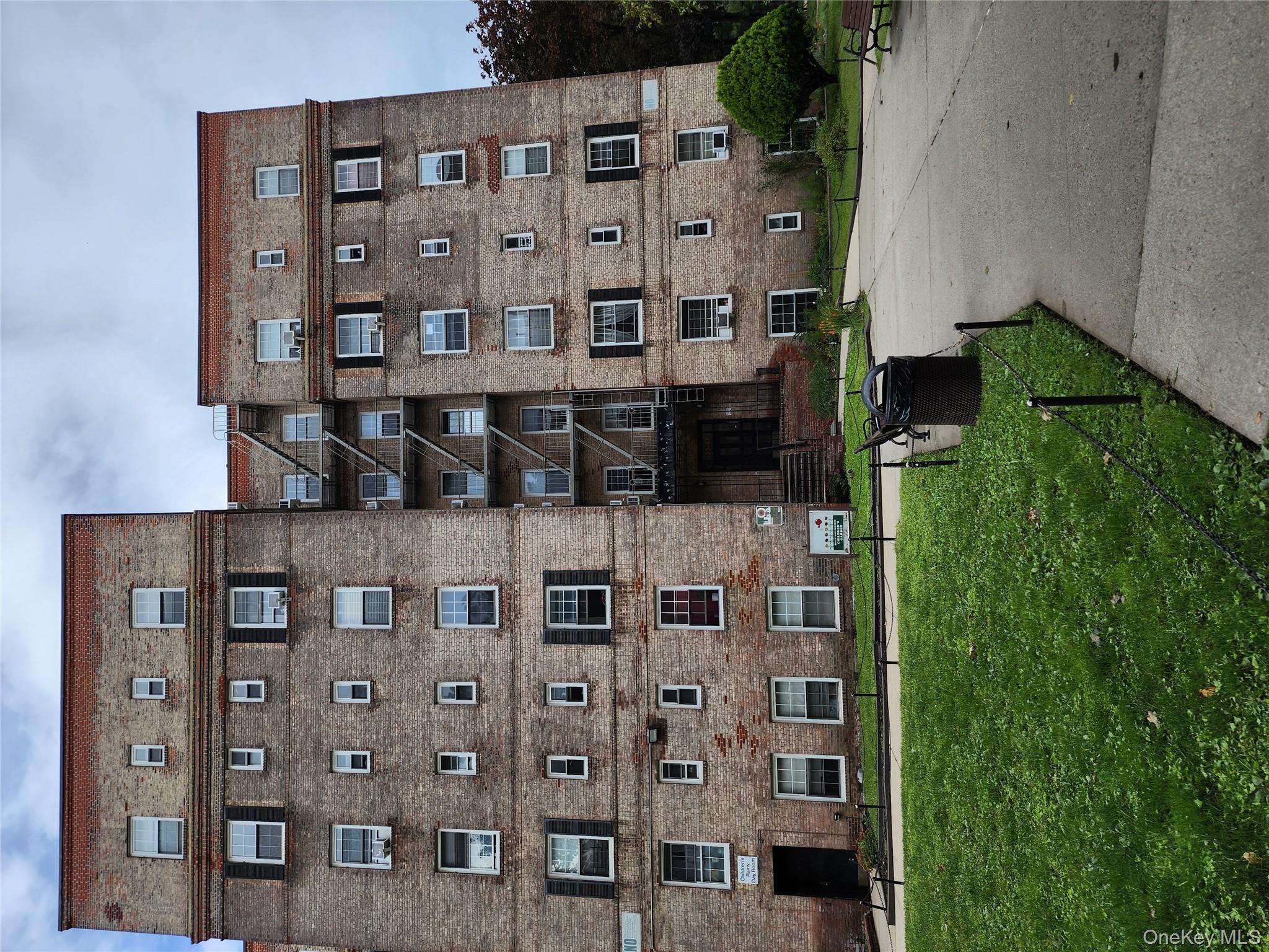 a view of a building with a yard