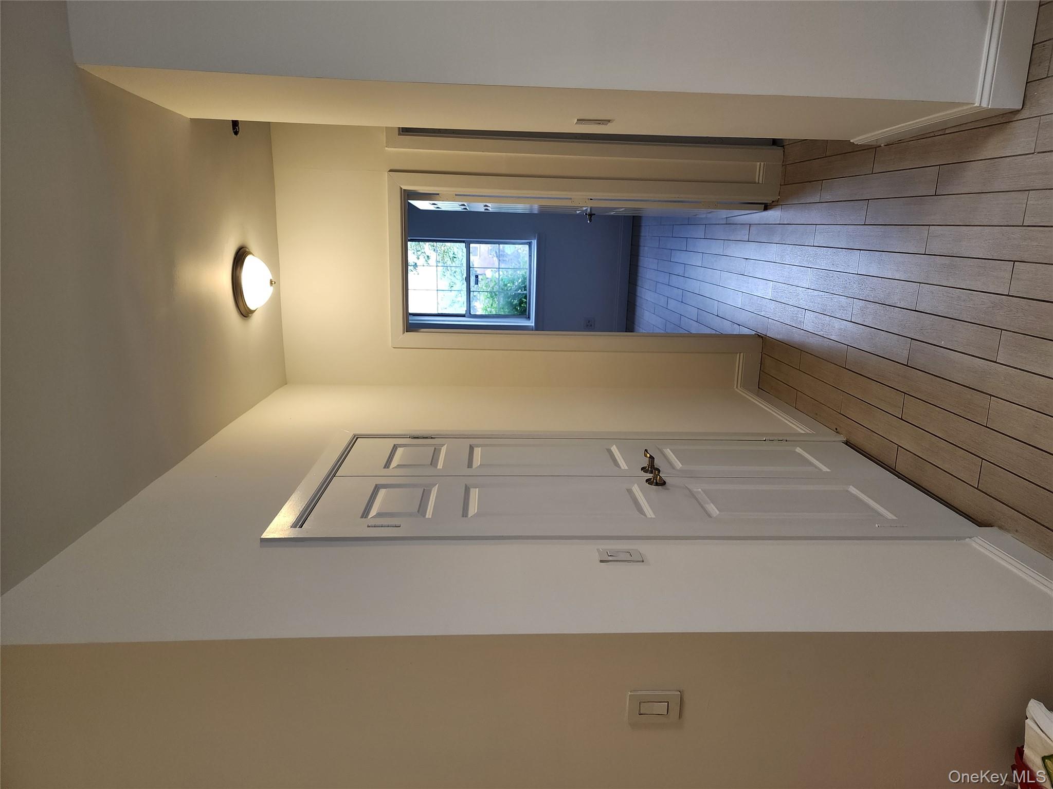 30-47 Hobart Street, Unit DDB Queens, NY 11377 - Photo 16 of 25 wooden floor in a gallery