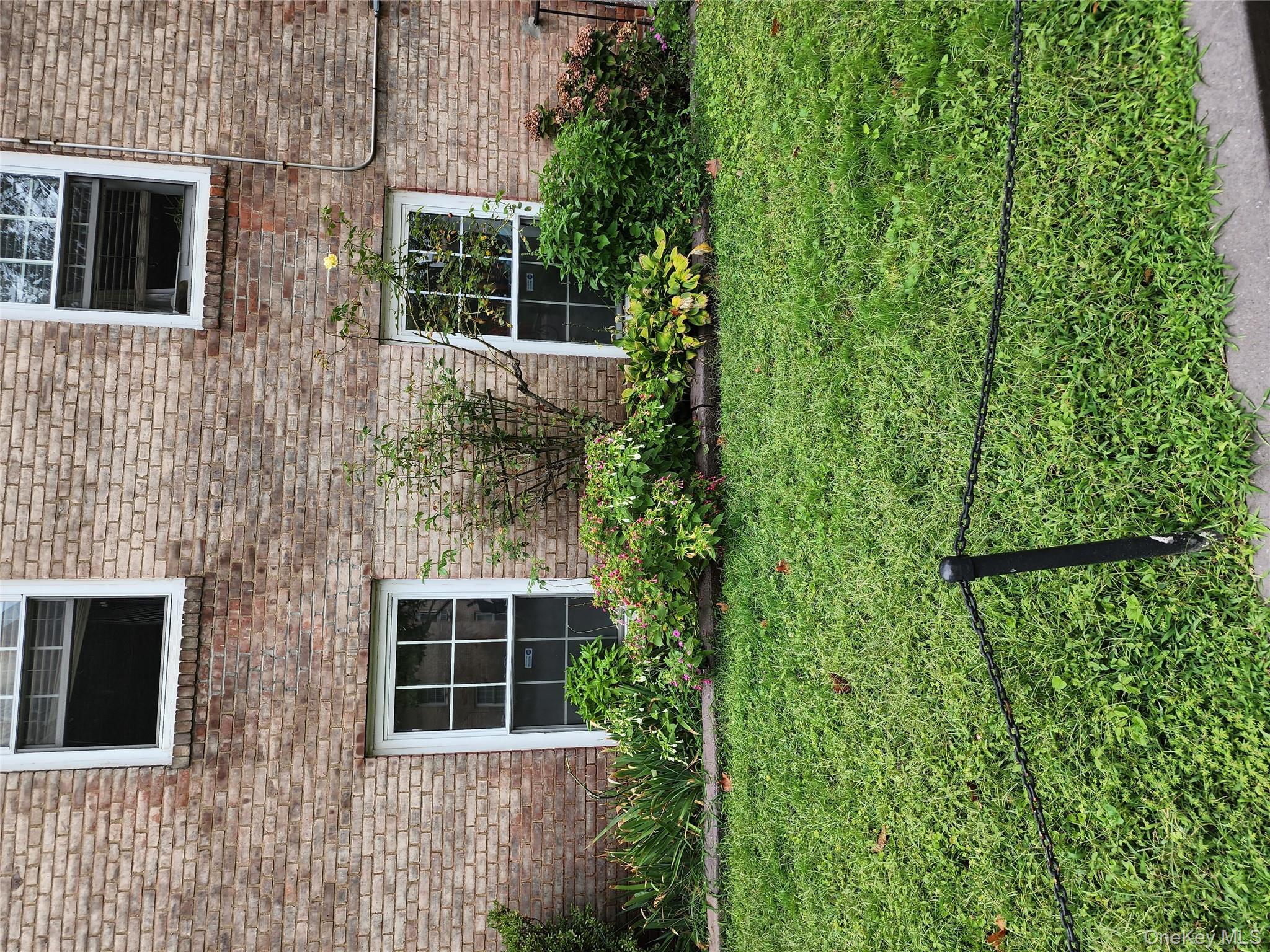 30-47 Hobart Street, Unit DDB Queens, NY 11377 - Photo 8 of 25 a front view of a house with garden