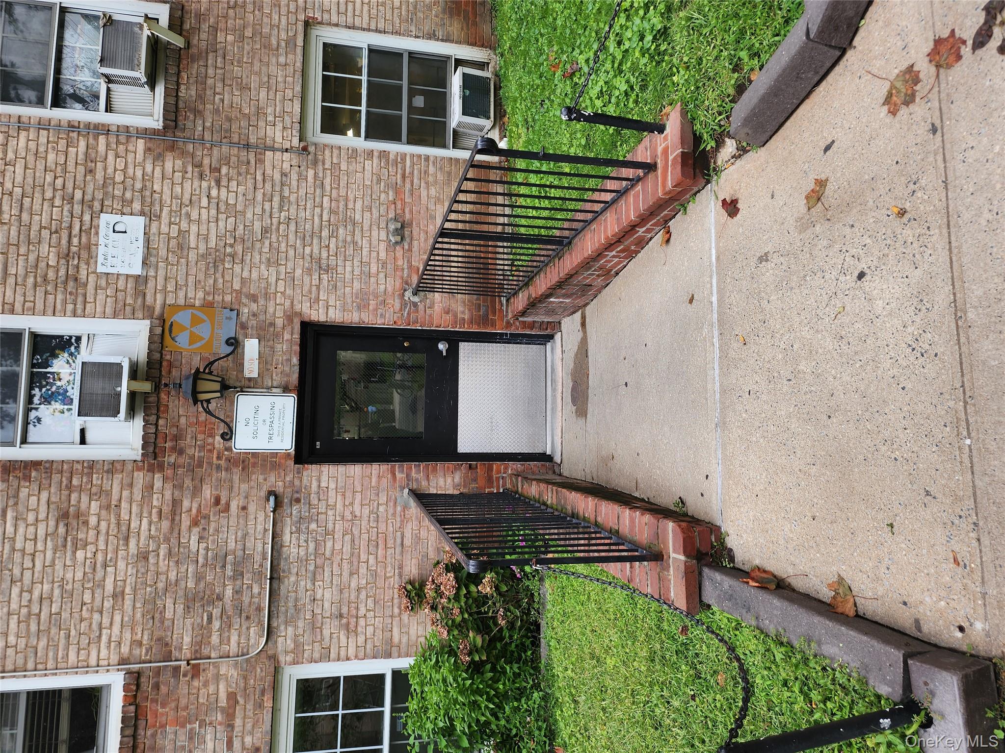 30-47 Hobart Street, Unit DDB Queens, NY 11377 - Photo 9 of 25 a front view of a house with a garden