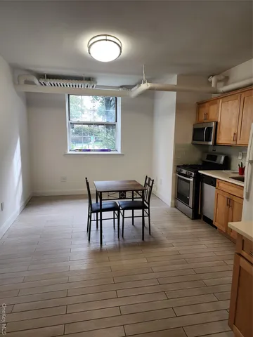 a view of a dining room kitchen and a window
