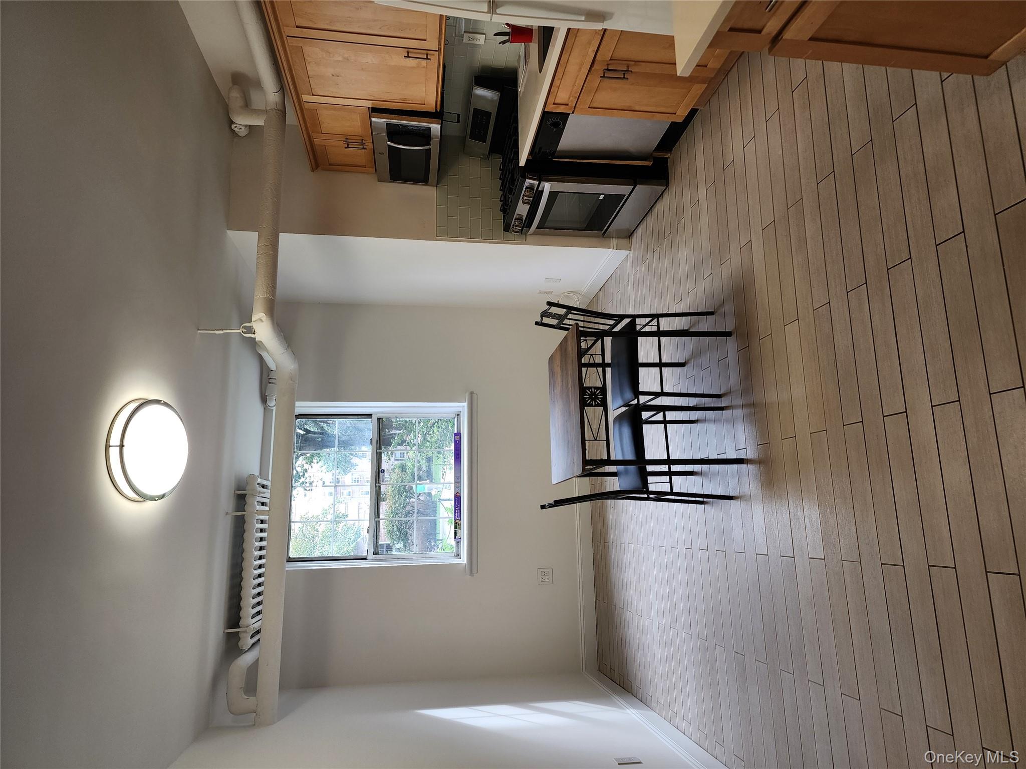 30-47 Hobart Street, Unit DDB Queens, NY 11377 - Photo 10 of 25 a view of a dining room kitchen and a window