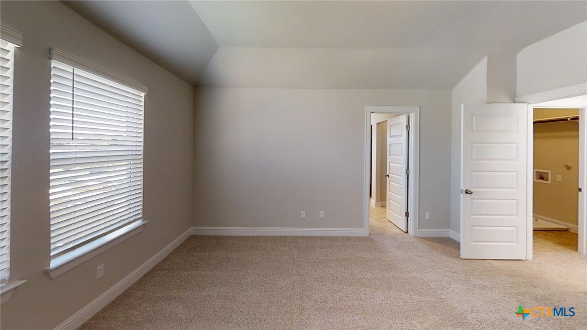 116 Hidden Branch Cove Maxwell, TX 78656 - Photo 21 of 23 an empty room with windows and closet