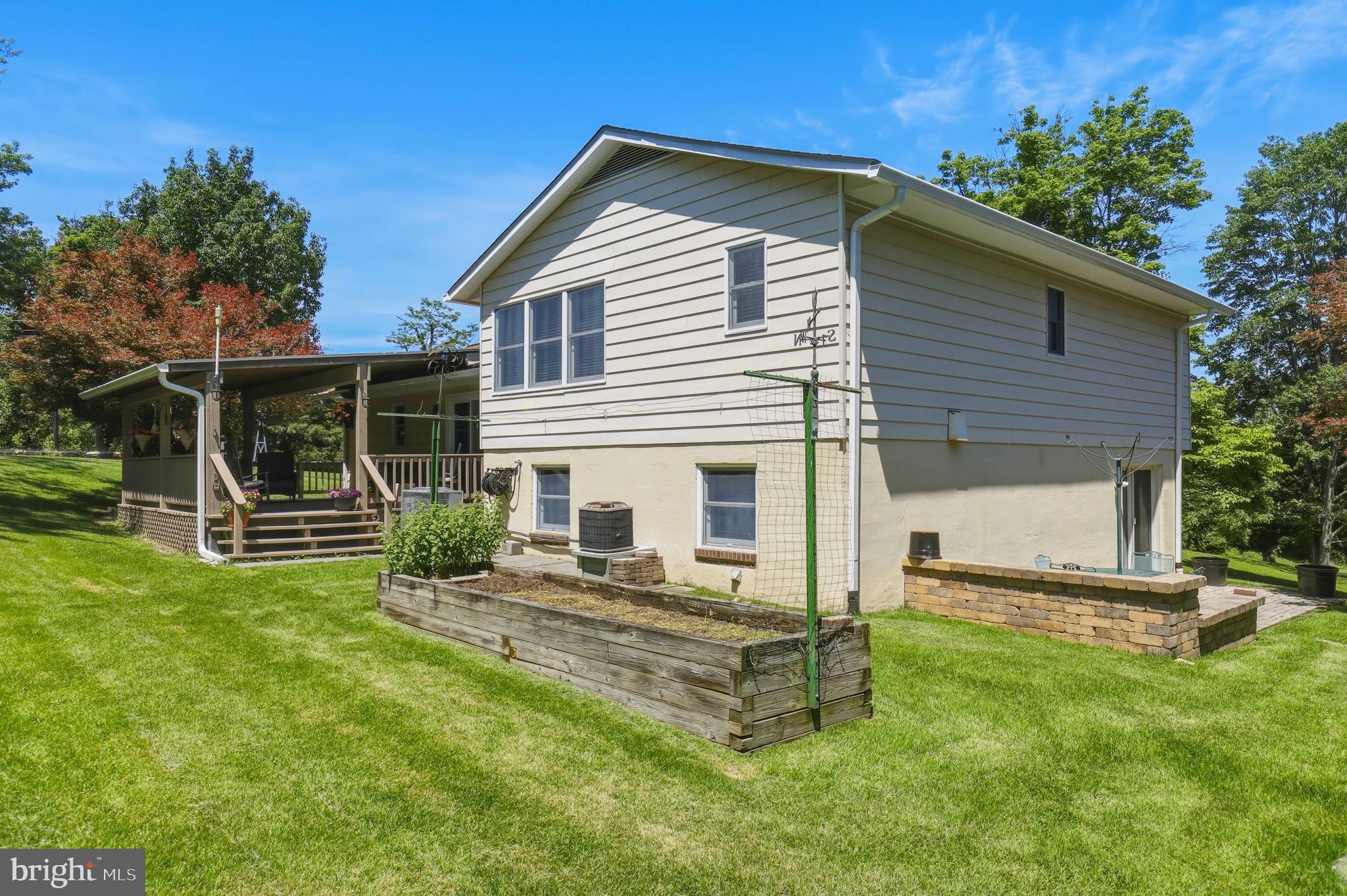 6336 Boyers Mill Road New Market, MD 21774 - Photo 41 of 49 a front view of house with yard and green space