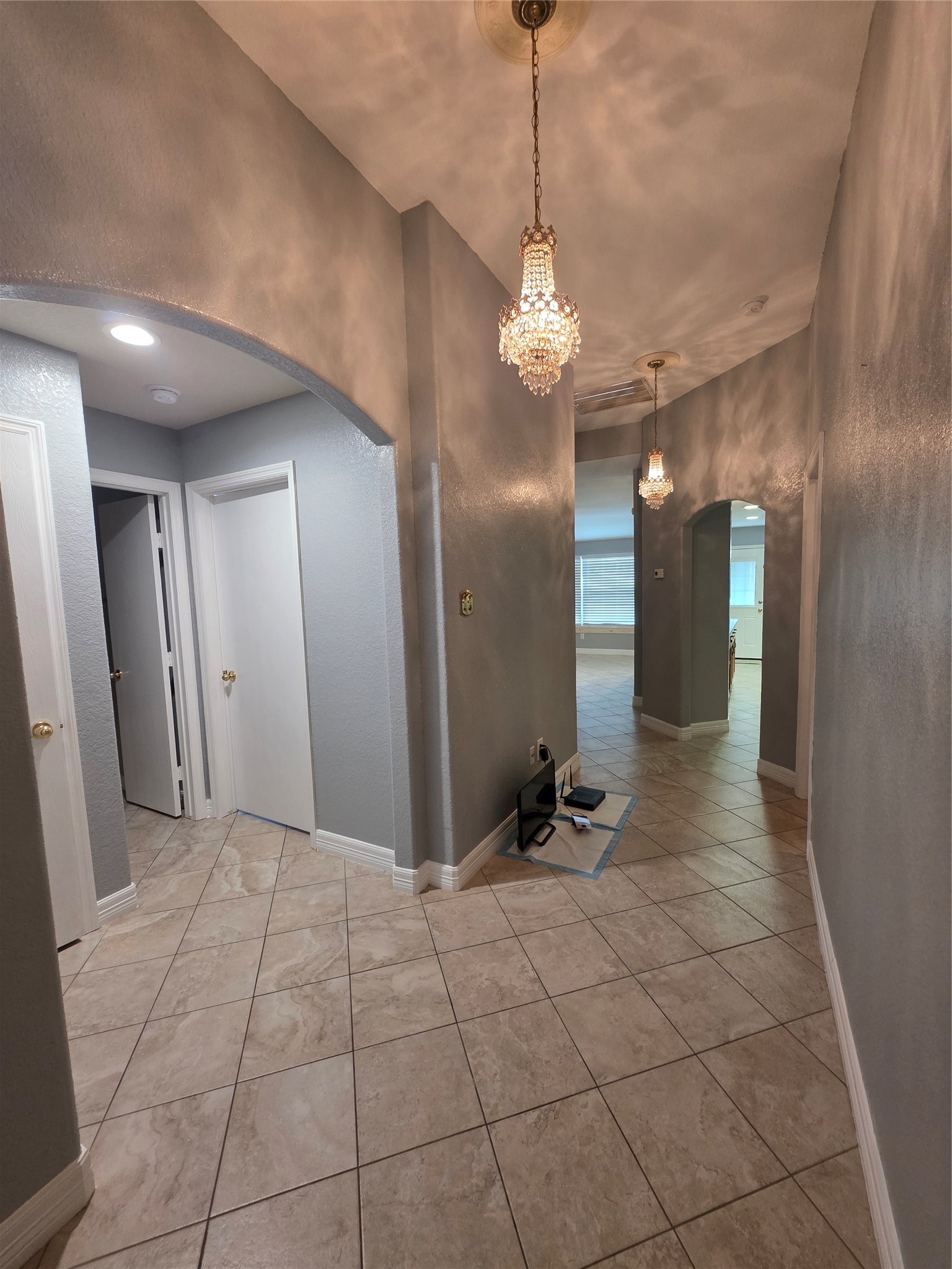 5614 Eagle Landing Houston, TX 77085 - Photo 14 of 28 a view of a hallway with a chandelier