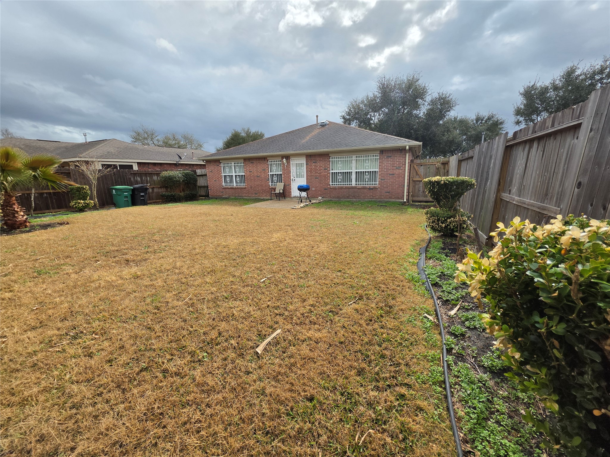 5614 Eagle Landing Houston, TX 77085 - Photo 24 of 28 a front view of a house with a garden