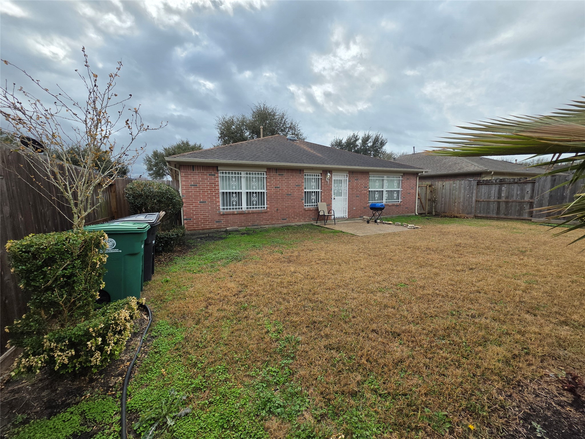 5614 Eagle Landing Houston, TX 77085 - Photo 26 of 28 a view of a house with a yard and potted plants
