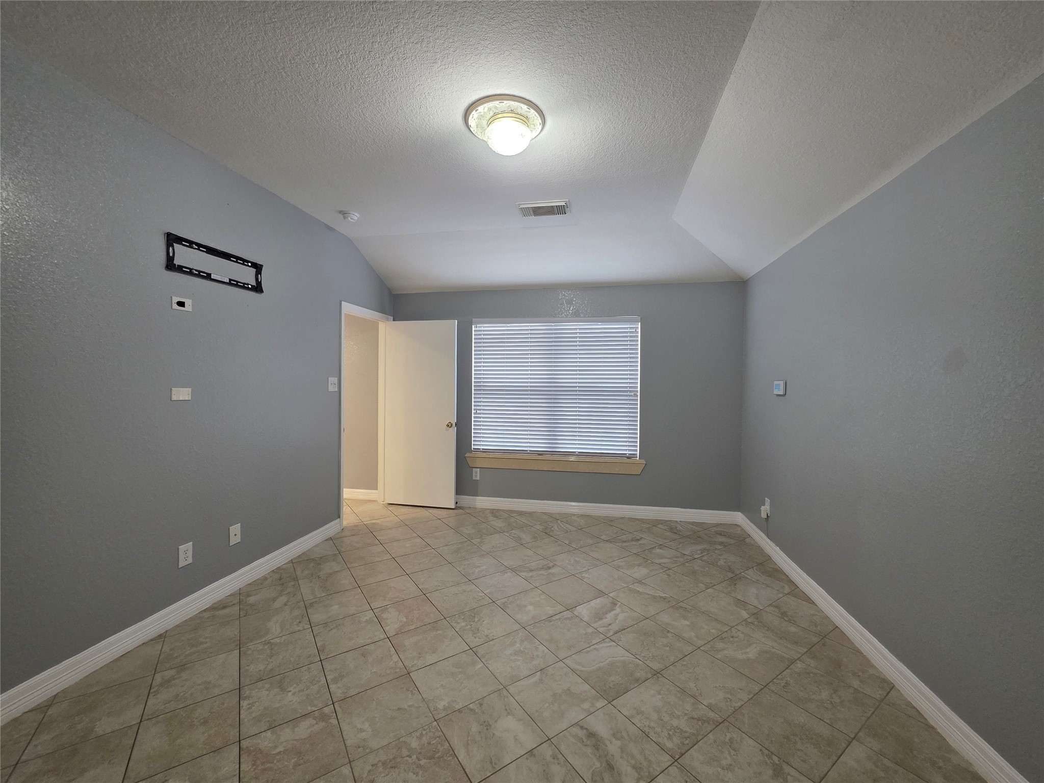 5614 Eagle Landing Houston, TX 77085 - Photo 8 of 28 a view of an empty room with a window