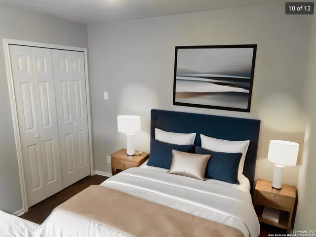 a bedroom with a bed and a night stand