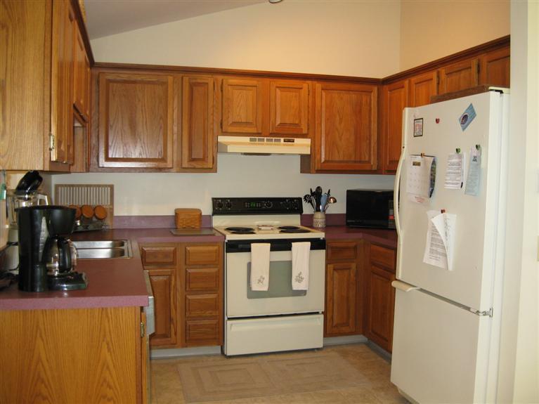 52 Clark Road Brewster, MA 02631 - Photo 11 of 32 a kitchen with a stove a refrigerator and a sink