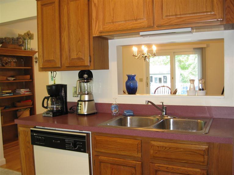 52 Clark Road Brewster, MA 02631 - Photo 12 of 32 a kitchen with stainless steel appliances granite countertop a sink and a cabinets