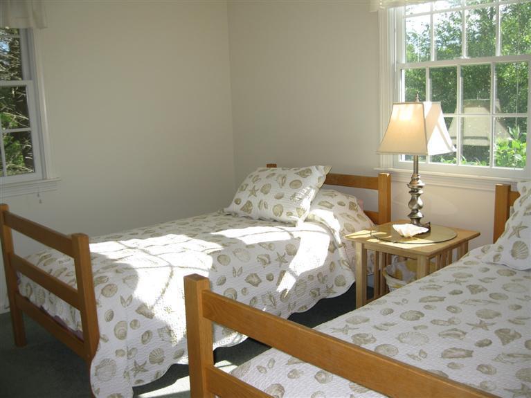 52 Clark Road Brewster, MA 02631 - Photo 17 of 32 a bed sitting in a bedroom next to a window