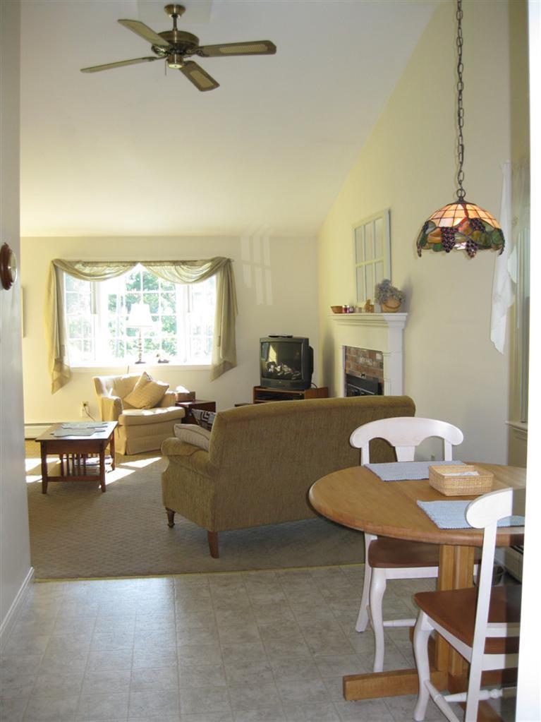 52 Clark Road Brewster, MA 02631 - Photo 19 of 32 a living room with furniture and a table