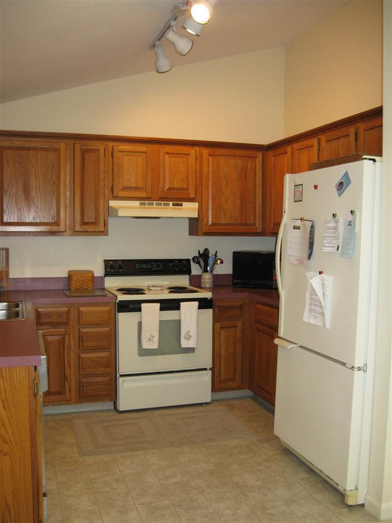 52 Clark Road Brewster, MA 02631 - Photo 21 of 32 a white refrigerator freezer sitting in a kitchen