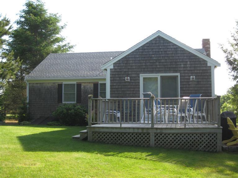 52 Clark Road Brewster, MA 02631 - Photo 3 of 32 a front view of a house with a garden