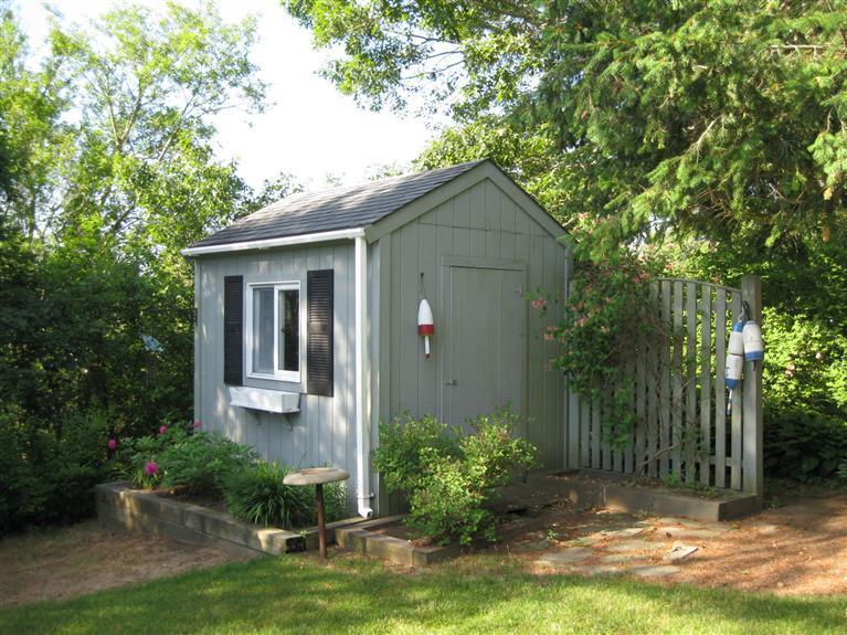 52 Clark Road Brewster, MA 02631 - Photo 4 of 32 a front view of a house with garden