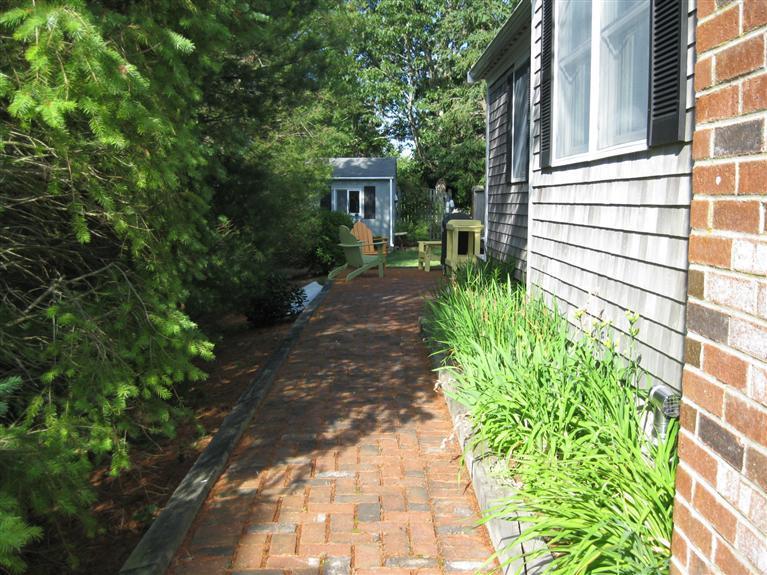 52 Clark Road Brewster, MA 02631 - Photo 5 of 32 a house with a tree in front of it