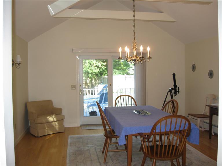 52 Clark Road Brewster, MA 02631 - Photo 10 of 32 a view of a dining room with furniture and chandelier