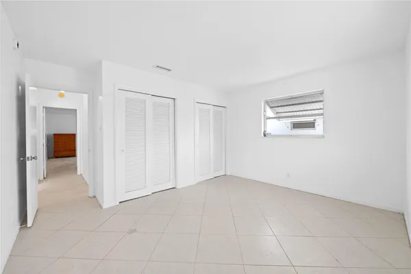 an empty room with a bathroom