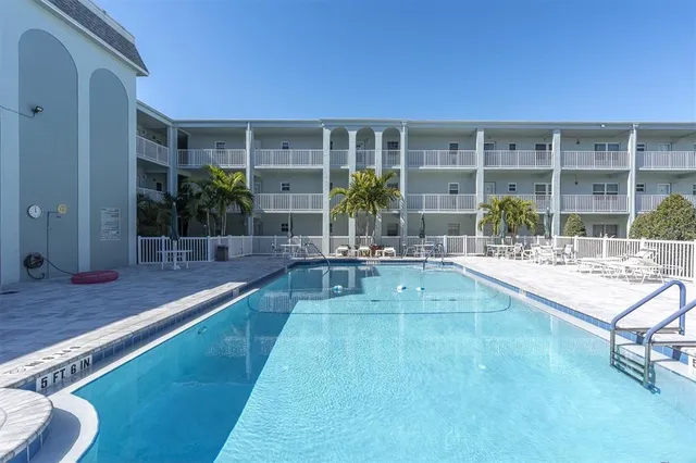 a view of a living room and kitchen with a large window