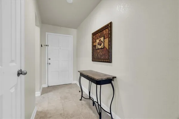 a view of a hallway with paintings on the wall