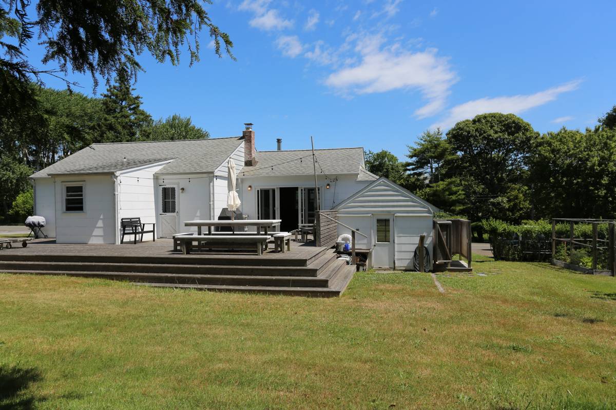33 South Delrey Road Montauk, NY 11954 - Photo 15 of 15 a view of a house with swimming pool and a yard