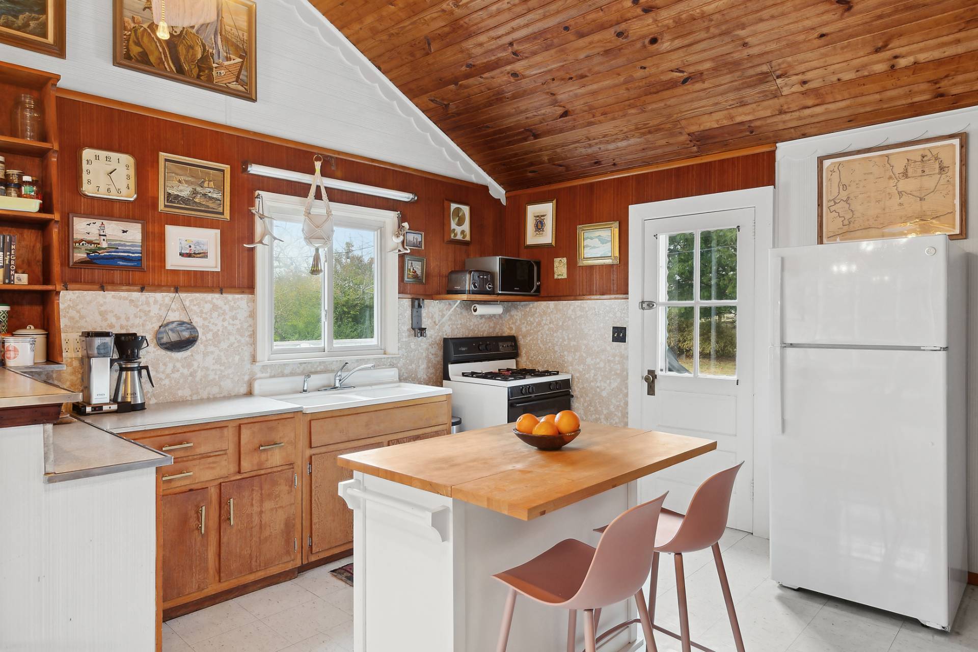33 South Delrey Road Montauk, NY 11954 - Photo 6 of 15 a kitchen with a sink a stove and chairs