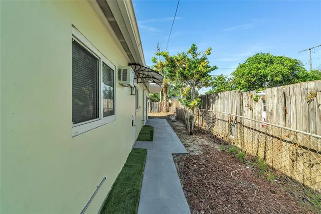 a view of a pathway with a backyard