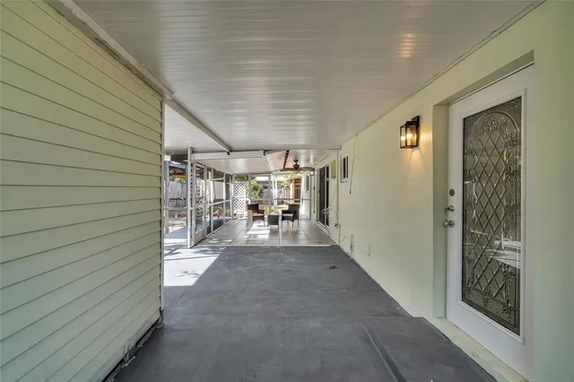 a view of a porch with furniture