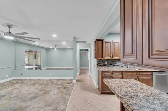 a bathroom with a tub a sink and a mirror