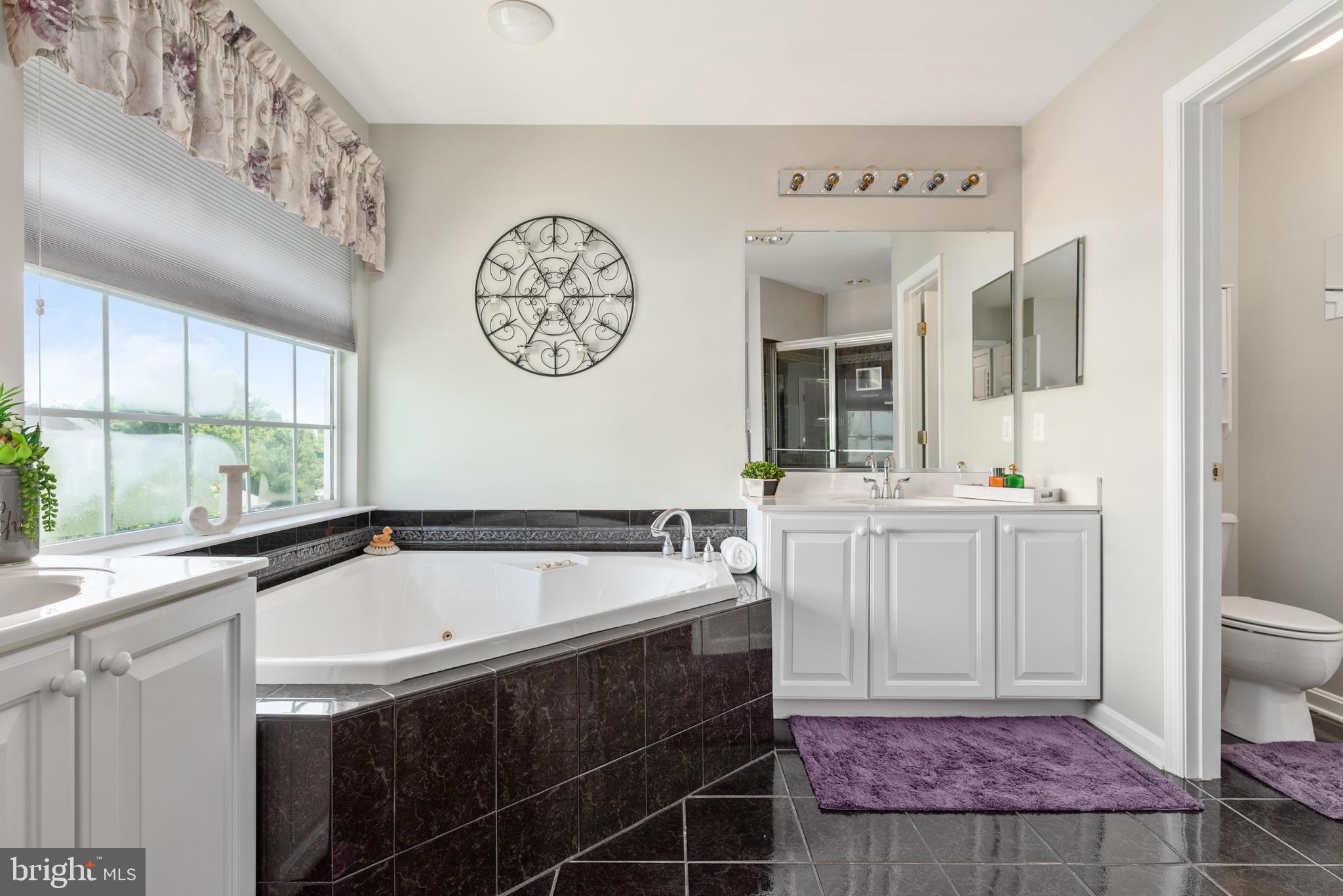610 Sand Road Severn, MD 21144 - Photo 22 of 43 Master bath with custom tile & soaking tub