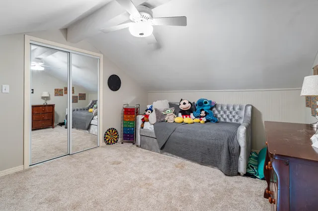 a room with toys and a book shelf