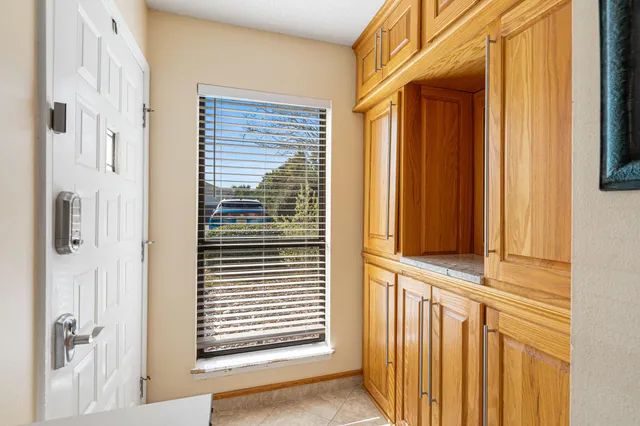 a kitchen with stainless steel appliances granite countertop a refrigerator a stove and a sink with granite countertops