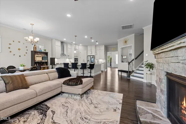 a living room with fireplace furniture and a fireplace