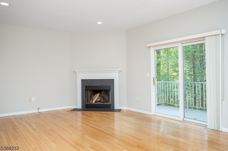 637 Old Dover Road Morris Plains, NJ 07950 - Photo 11 of 28 a view of an empty room with a fireplace and a window