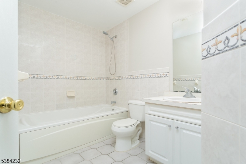 637 Old Dover Road Morris Plains, NJ 07950 - Photo 16 of 28 a bathroom with a sink a toilet and shower