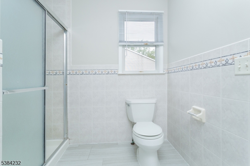 637 Old Dover Road Morris Plains, NJ 07950 - Photo 23 of 28 a white toilet sitting next to a window