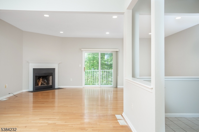 637 Old Dover Road Morris Plains, NJ 07950 - Photo 9 of 28 a view of an empty room with a window and fireplace