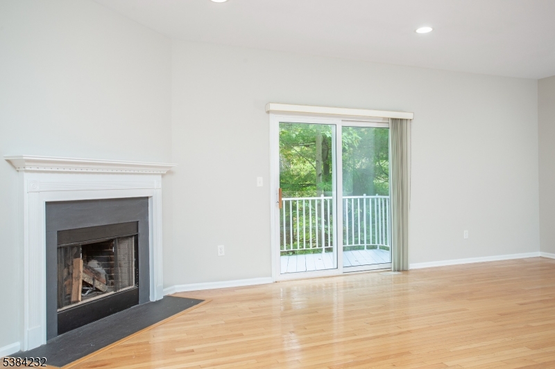 637 Old Dover Road Morris Plains, NJ 07950 - Photo 10 of 28 a view of an empty room with wooden floor and a window