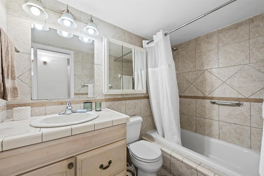 1000 Southeast 15th Street, Unit 103 Fort Lauderdale, FL 33316 - Photo 8 of 15 a bathroom with a sink toilet a mirror and shower