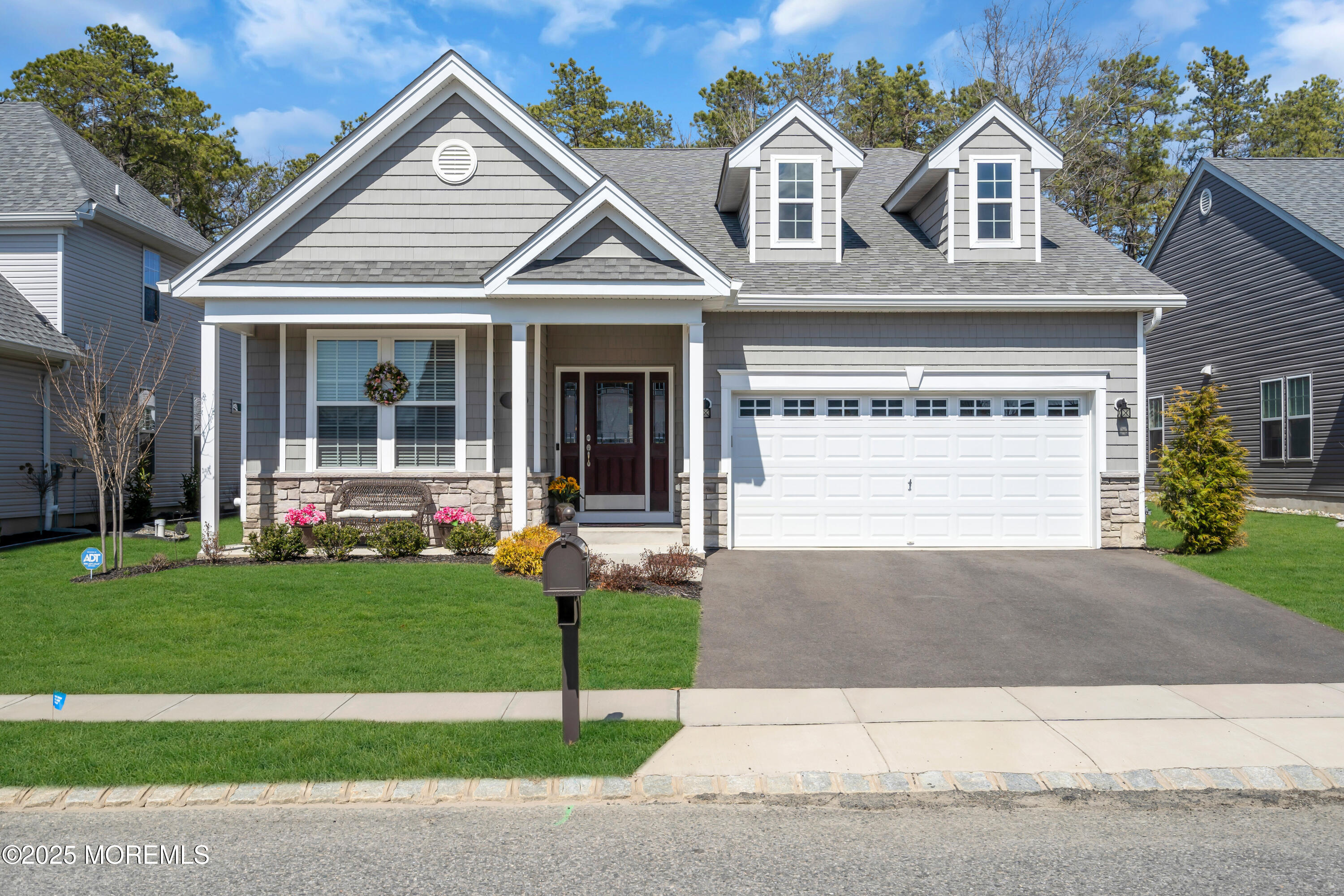 65 Moonlight Drive Barnegat, NJ 08005 - Photo 1 of 68 a front view of a house with a yard and garage