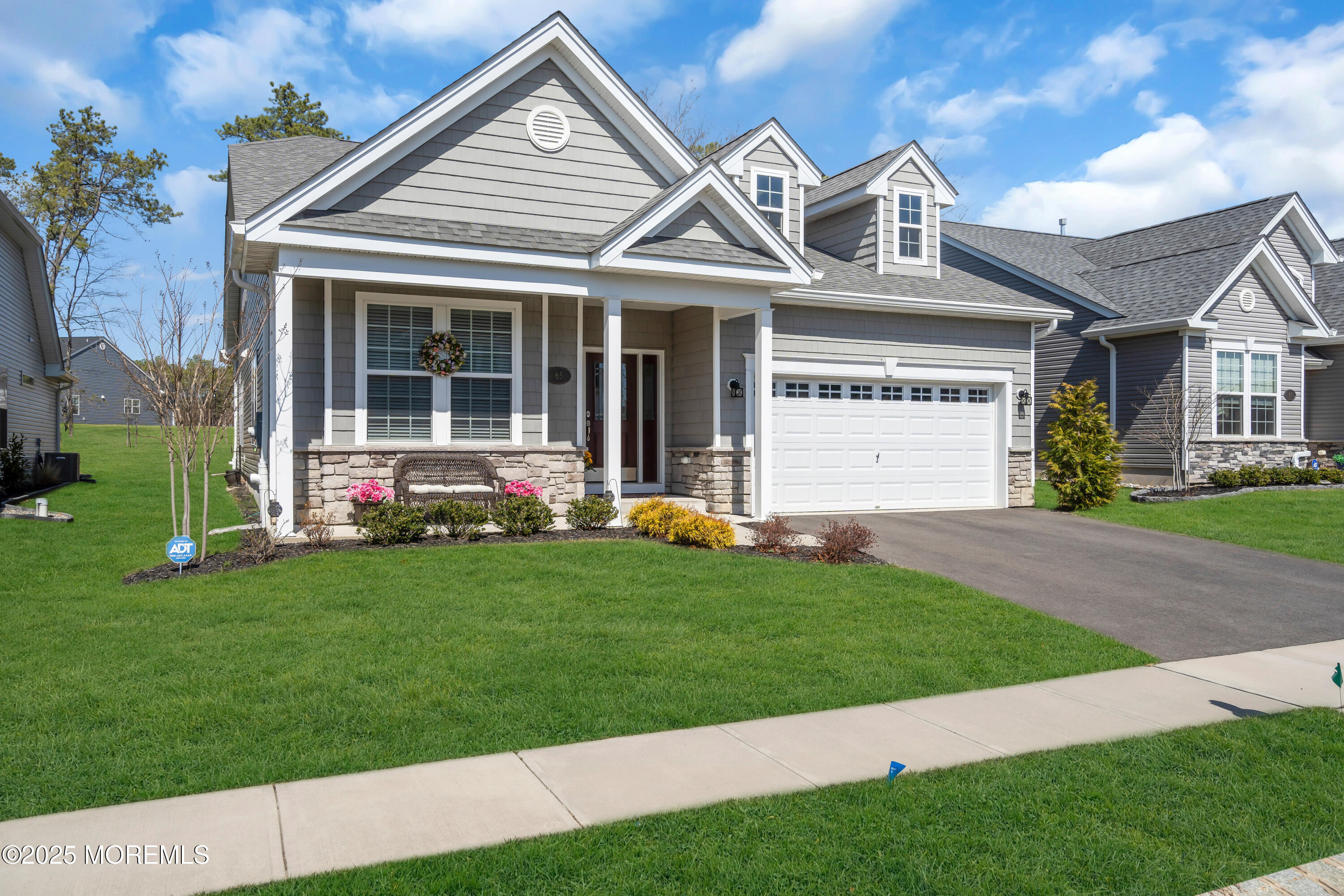 65 Moonlight Drive Barnegat, NJ 08005 - Photo 2 of 68 a front view of a house with a yard